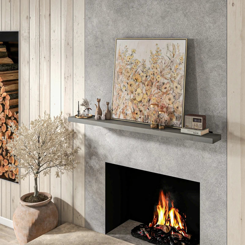 Fireplace shelf displaying decor items and photos