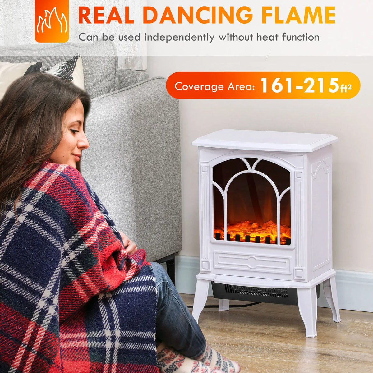 White freestanding electric fireplace in a cozy living room setting.