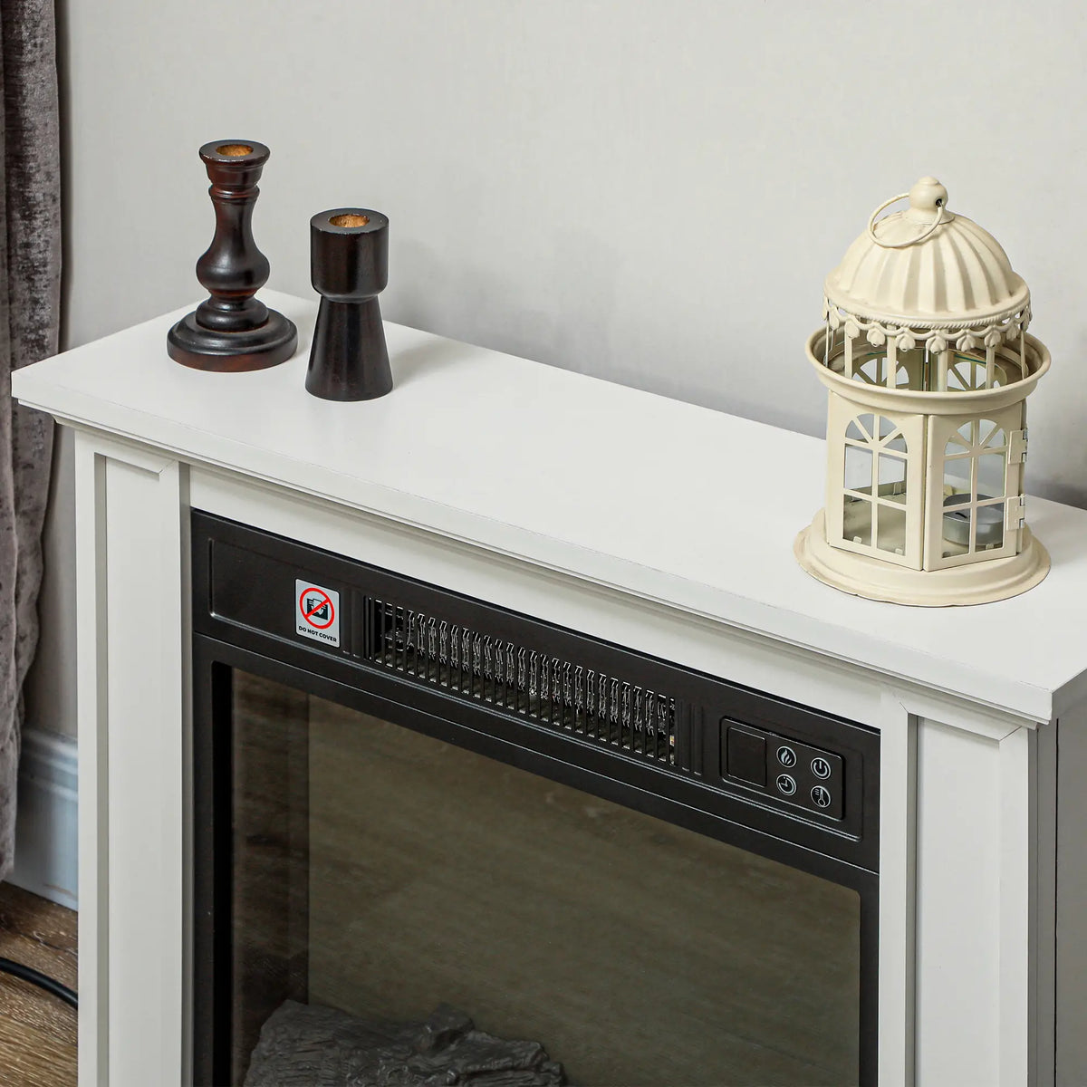 White electric fireplace heater with elegant mantel design